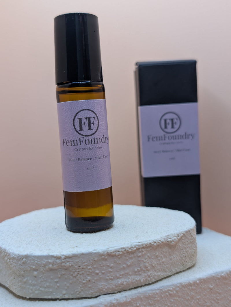 Inner Balance pulse point roller in a glass bottle with a minimalist label for calming aromatherapy support.