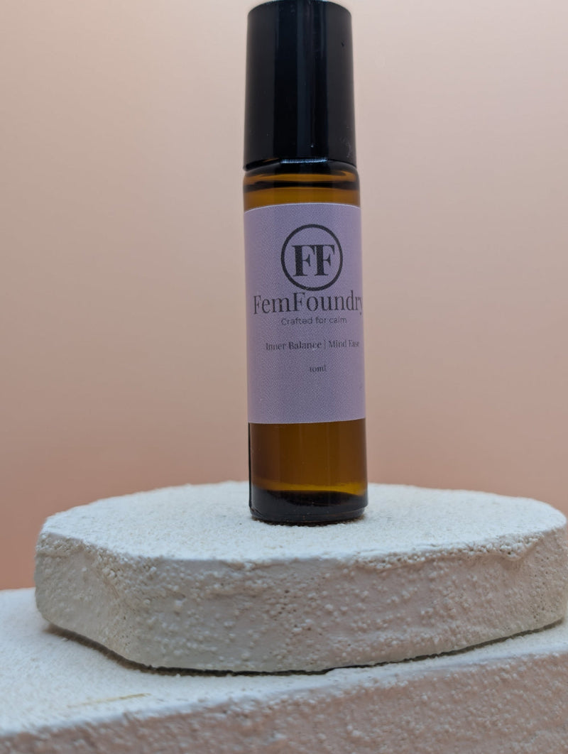 Inner Balance pulse point roller in a glass bottle with a minimalist label for calming aromatherapy support.