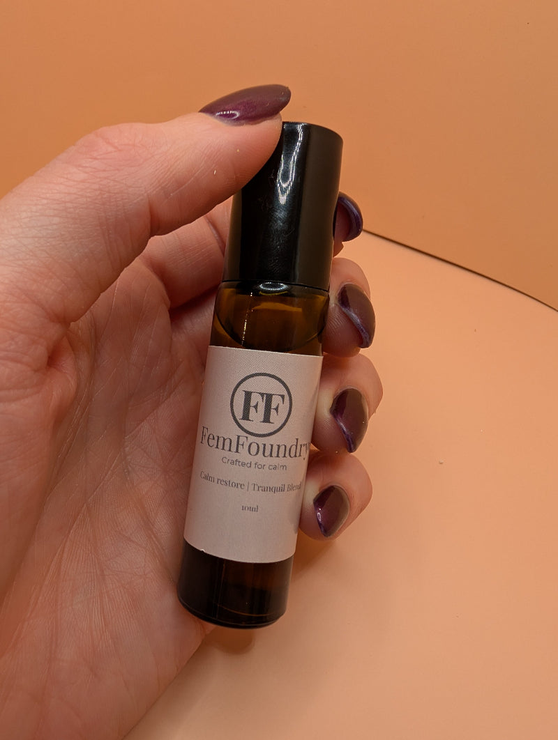 Calm Restore Pulse Point Roller in hand.